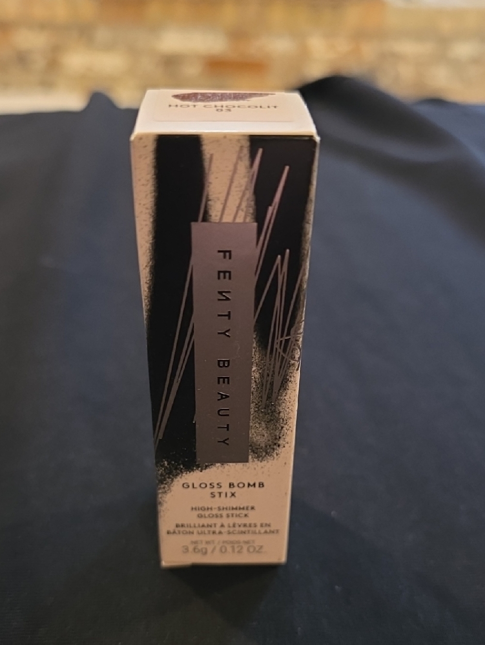 Fenty Beauty Gloss Bomb - Hot Chocolit (shimmery brown)
